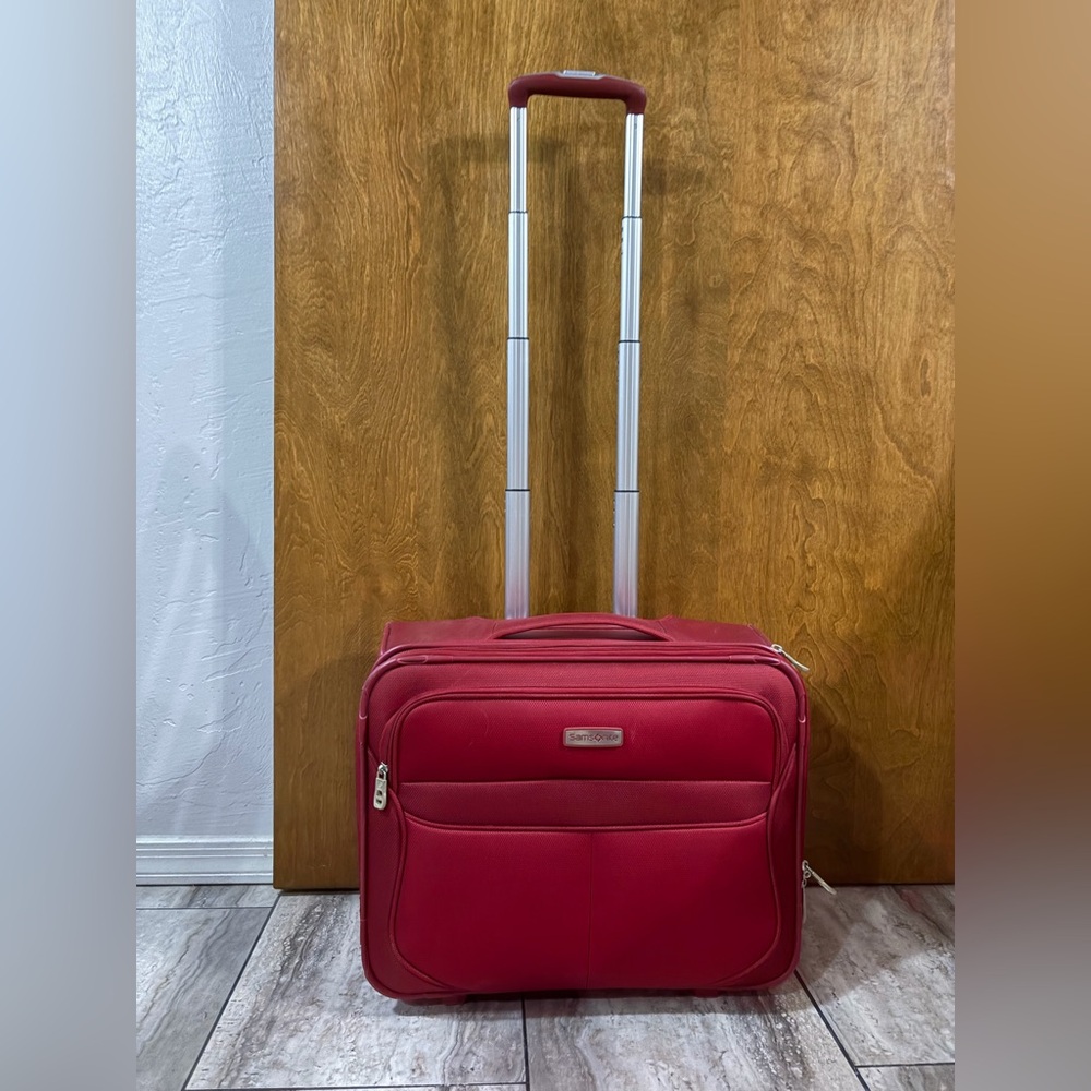 Red Samsonite overnighter with wheels